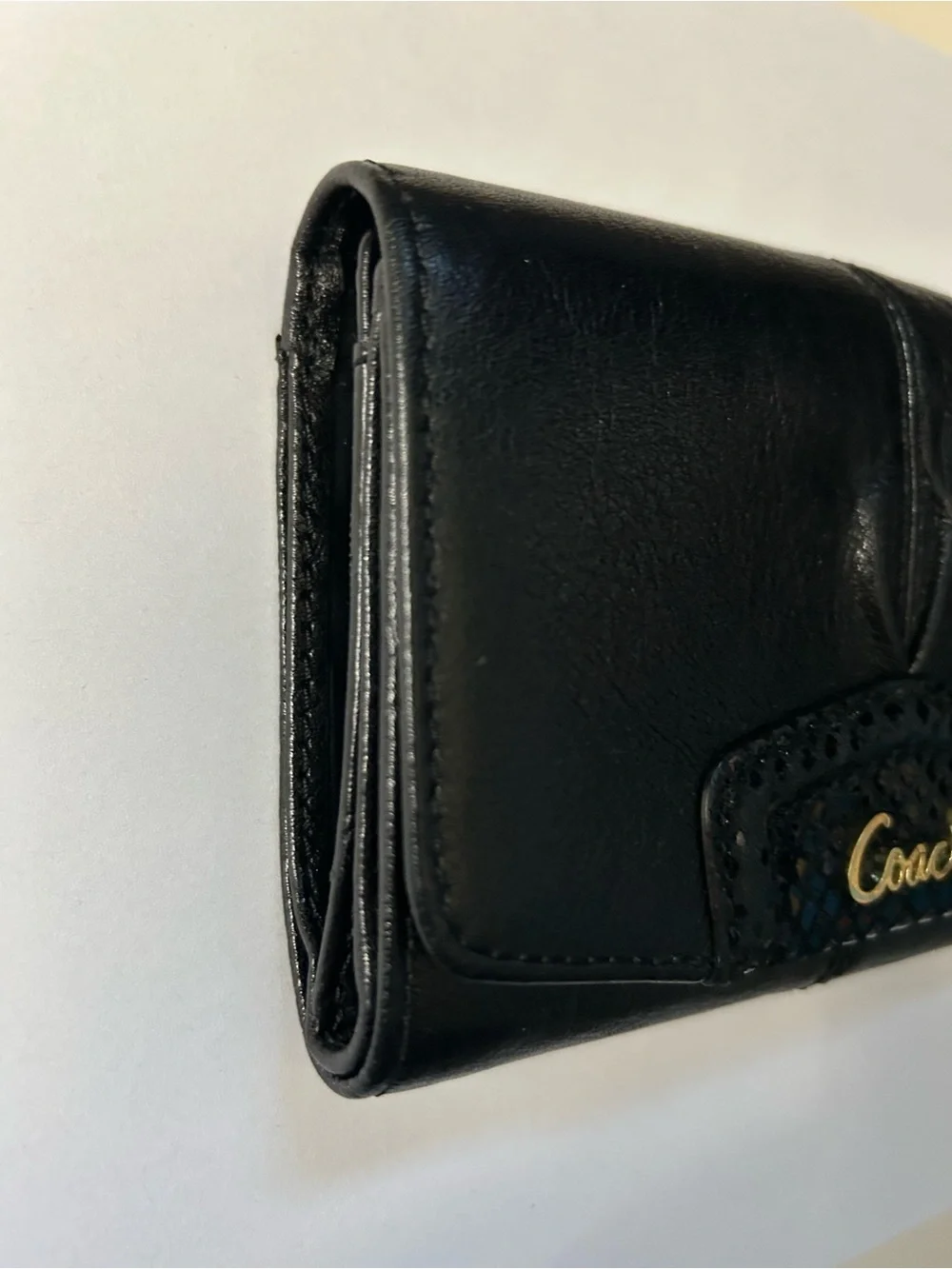 Coach Women’s Black Tri-Fold Wallet with Gold Script Logo